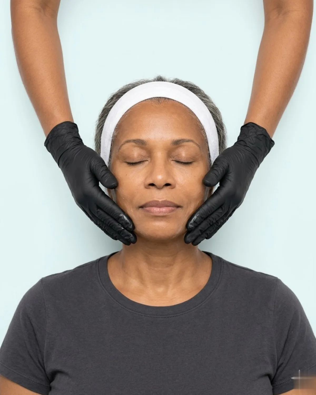 KiWest Spa esthetician performing a firming lifting massage during the Revival anti-aging facial in Belleville, Barbados